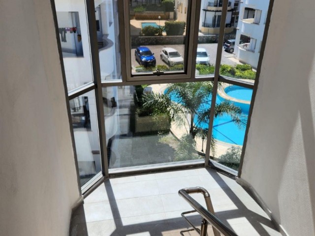 New 2+1 flat for sale in a centrally located site with a shared pool in Alsancak