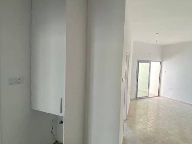 New 2+1 flat for sale in a centrally located site with a shared pool in Alsancak