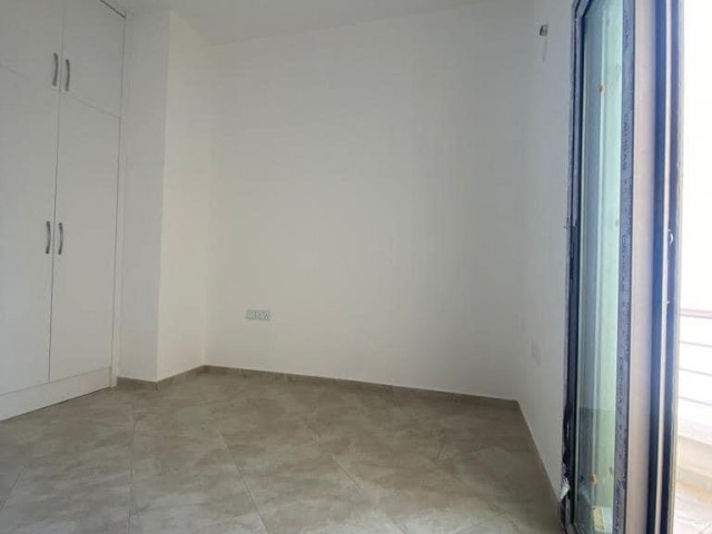 New 2+1 flat for sale in a centrally located site with a shared pool in Alsancak