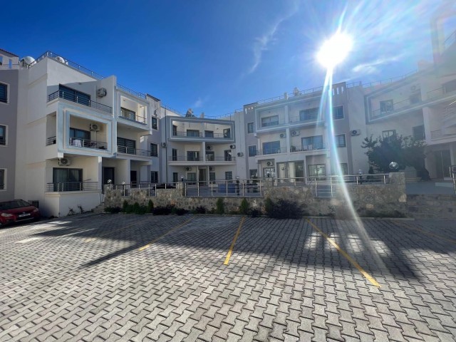 New 2+1 flat for sale in a centrally located site with a shared pool in Alsancak