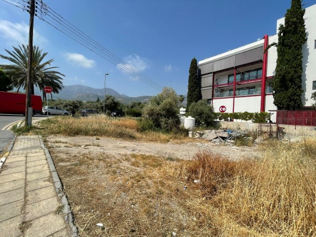 A land plot for sale with a project of a Decommissioned apartment and a shop on the highway as well as sushico in the center of Kyrenia ** 