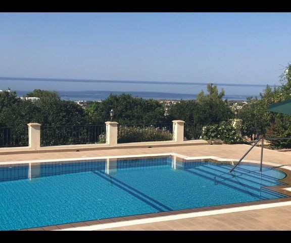 950m2 with magnificent mountain and sea views in Çatalköy. this magnificent villa with 5 bedrooms and a swimming pool in 3.5 acres of land, the view of which is never closed ** 