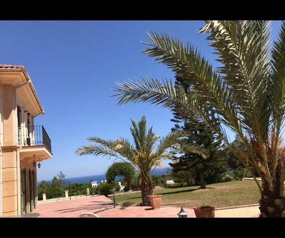 950m2 with magnificent mountain and sea views in Çatalköy. this magnificent villa with 5 bedrooms and a swimming pool in 3.5 acres of land, the view of which is never closed ** 