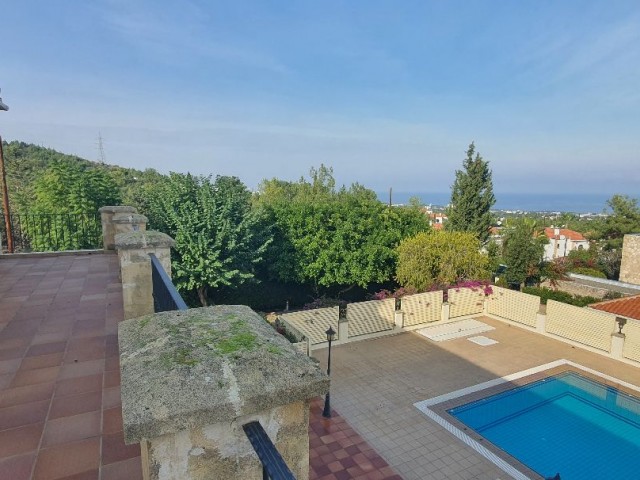 950m2 with magnificent mountain and sea views in Çatalköy. this magnificent villa with 5 bedrooms and a swimming pool in 3.5 acres of land, the view of which is never closed ** 