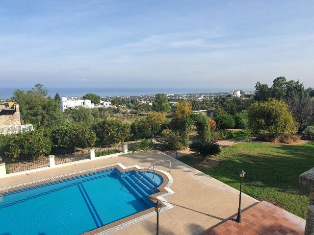 950m2 with magnificent mountain and sea views in Çatalköy. this magnificent villa with 5 bedrooms and a swimming pool in 3.5 acres of land, the view of which is never closed ** 