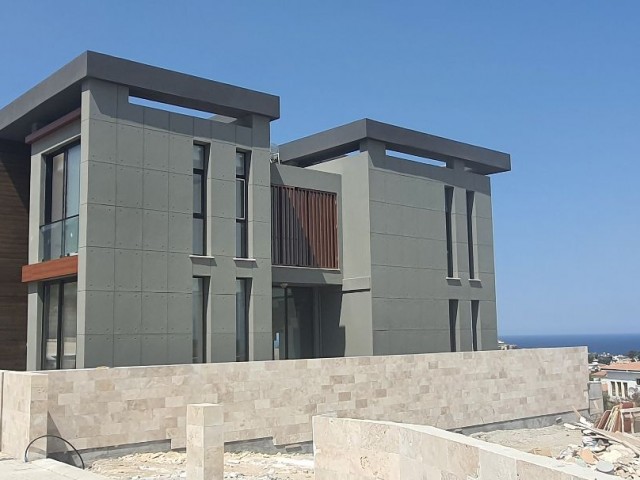 Kyrenia Escape Beach area 4+1 detached villa.Full sea view, pool view...(Equivalent Title Deed)Finished 275,000 STG, they will be finished after 1 year 250,000 STG ** 