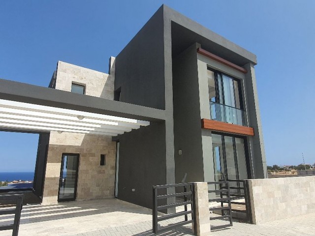 Kyrenia Escape Beach area 4+1 detached villa.Full sea view, pool view...(Equivalent Title Deed)Finished 275,000 STG, they will be finished after 1 year 250,000 STG ** 