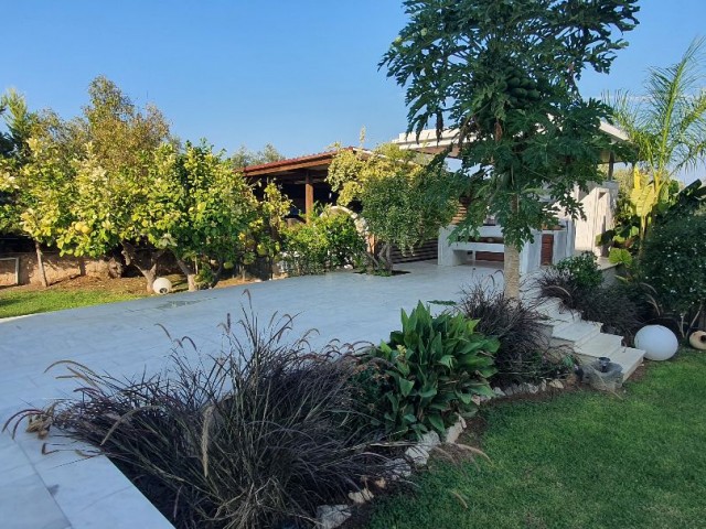 Girne Karakum region with Turkish Land Registry, 1600 m2 garden, 4x11m. Salt system pool, underfloor heating system, Award-winning architect drawing 320m2 closed area, 4 bedrooms and ten suites. Modern tasteful villa