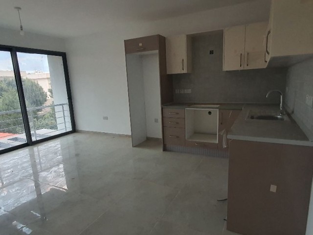 2+1 luxury flat in the center of Kyrenia, Turkish Hearth Club and Barbaroslar market area in a brand new building. VAT unpaid
