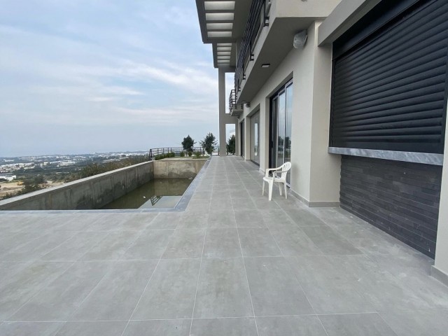 In the mountain slope area of Girne American University, ready for delivery with panoramic mountain and sea views, 4+1 villa with 1000 m2 garden and pool. 