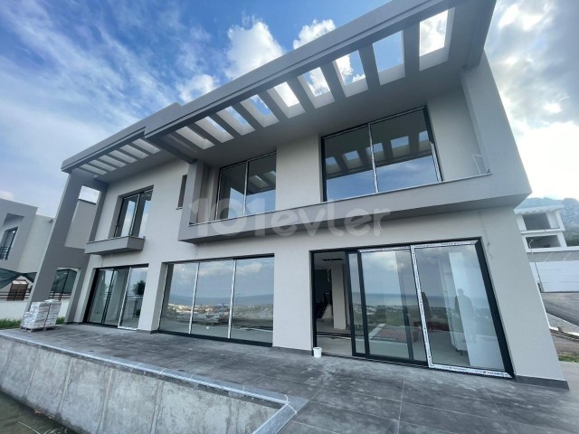 In the mountain slope area of Girne American University, ready for delivery with panoramic mountain and sea views, 4+1 villa with 1000 m2 garden and pool. 
