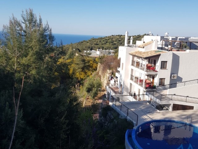 2+1 Villa with Sea View in a Luxury Holiday Site in Karmi, Kyrenia, for Sale with Pool, Sauna and Pool Bar
