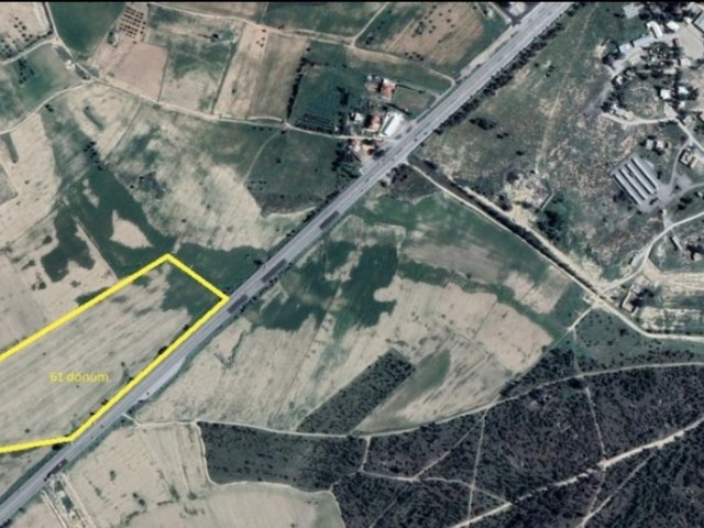 Fadıl 96 60 decare investment land with commercial and residential zoning, fronting the Famagusta Aslanköy main road. It will be sold for 40,000 stg per acre.