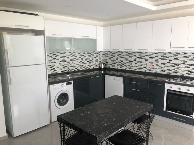 2+1 GROUND FLOOR FLAT FOR SALE IN GIRNE LAPTADA WITH COMMON POOL AND CENTRAL HEATING/COOLING AVAILABLE