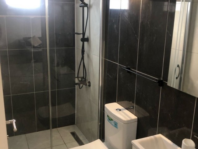 2+1 GROUND FLOOR FLAT FOR SALE IN GIRNE LAPTADA WITH COMMON POOL AND CENTRAL HEATING/COOLING AVAILABLE