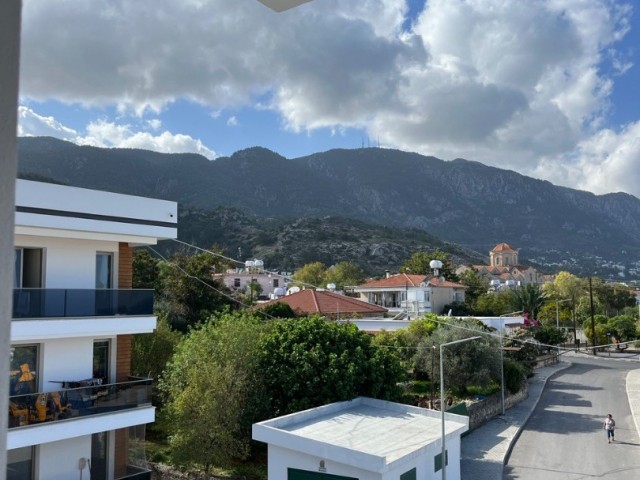 1+1 NEUE WOHNUNG MIT BERG- UND MEERBLICK ZUM VERKAUF IN GIRNE ALSANCAK