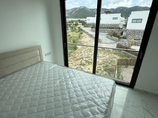 3+1 NEW PENTHOUSE WITH MOUNTAIN AND SEA VIEW FOR SALE IN GIRNE ESENTEPE WITH PRIVATE TERRACE, FULLY EQUIPPED AND CHIC DESIGN, VAT PAID