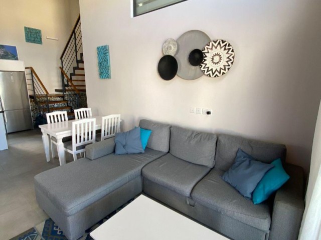 2+1 LOFT FLAT FOR SALE IN A QUIET ENVIRONMENT IN GIRNE ESNTEPE FULLY FURNISHED WITH SHARED POOL