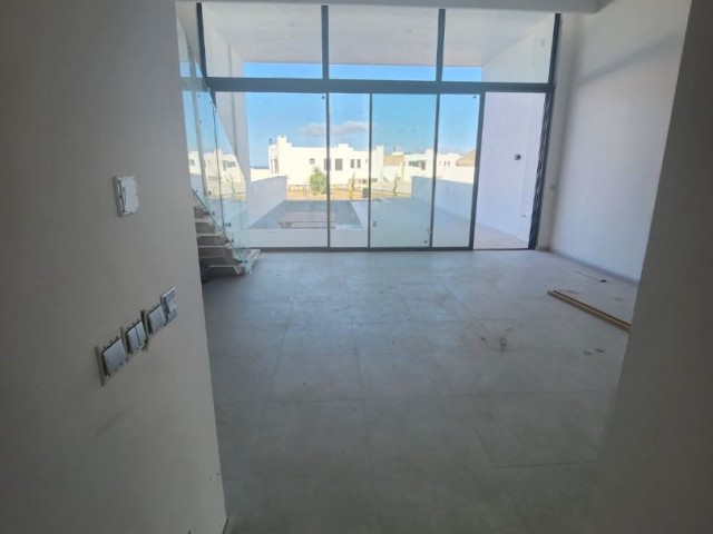 3+1 loft with garden for sale in a site with a private beach