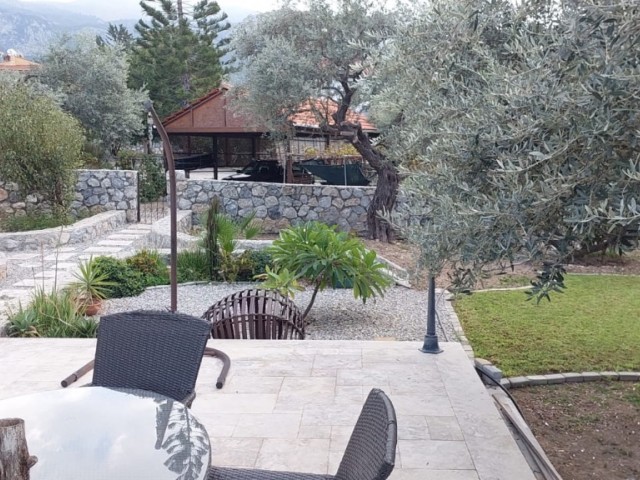 Luxury villa for sale with sea and mountain views and a large garden in the Çatalköy region of Kyrenia