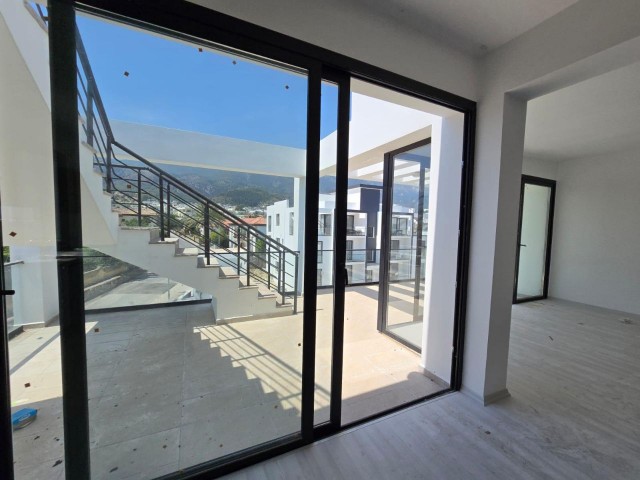 NEW ENSUITE 3+1 FLAT WITH MOUNTAIN AND SEA VIEWS IN GIRNE ALSANCAK AREA