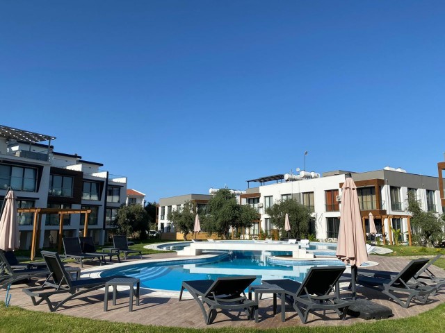 MODERN AND LUXURY 3+1 SEMI-DETACHED TRIPLEX VILLA WITH A WIDE TERRACE AND A COMMUNAL POOL IN GIRNE