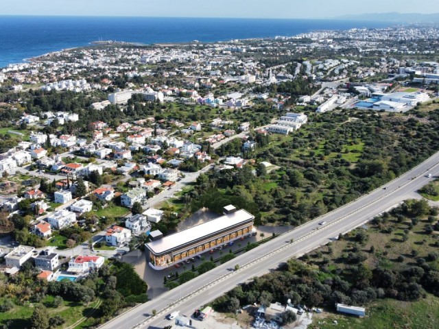 On Kyrenia Ring Road, with main road entrance (under construction), shops and offices