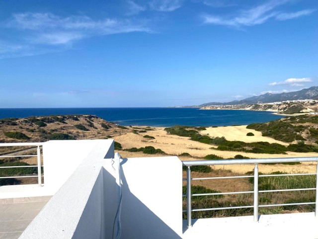 We are very Pleased to offer for sale this beautifully presented 3 bedroom townhouse with a location to live for. Situated on the seafront in Bahceli where the  aquamarines of the Mediterranean welcome you in  every room bar 1.  You also have in addition a large basement area with potential to conve