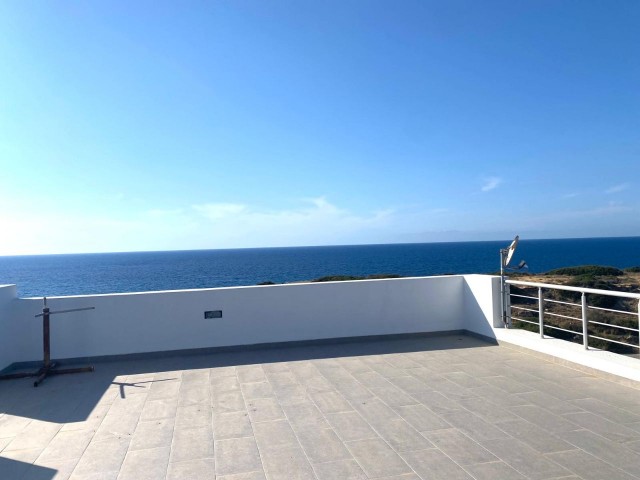 We are very Pleased to offer for sale this beautifully presented 3 bedroom townhouse with a location to live for. Situated on the seafront in Bahceli where the  aquamarines of the Mediterranean welcome you in  every room bar 1.  You also have in addition a large basement area with potential to conve