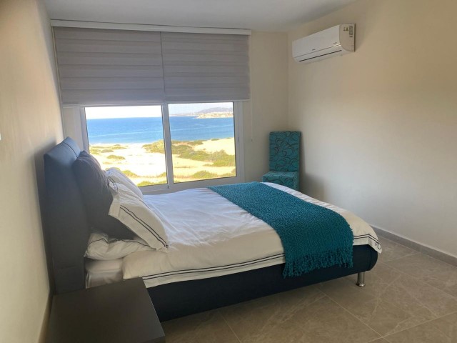 We are very Pleased to offer for sale this beautifully presented 3 bedroom townhouse with a location to live for. Situated on the seafront in Bahceli where the  aquamarines of the Mediterranean welcome you in  every room bar 1.  You also have in addition a large basement area with potential to conve