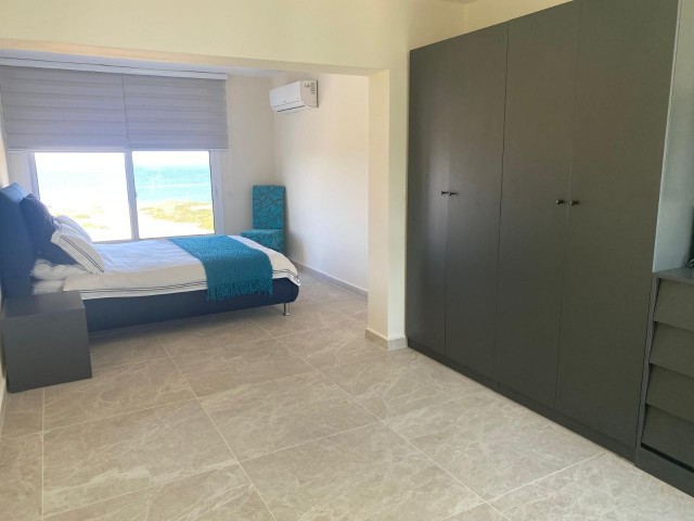 We are very Pleased to offer for sale this beautifully presented 3 bedroom townhouse with a location to live for. Situated on the seafront in Bahceli where the  aquamarines of the Mediterranean welcome you in  every room bar 1.  You also have in addition a large basement area with potential to conve