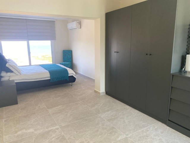 We are very Pleased to offer for sale this beautifully presented 3 bedroom townhouse with a location to live for. Situated on the seafront in Bahceli where the  aquamarines of the Mediterranean welcome you in  every room bar 1.  You also have in addition a large basement area with potential to conve