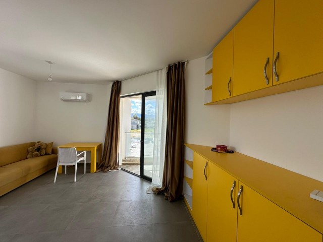 1+1 furnished flat by the sea, within the site, at an affordable price