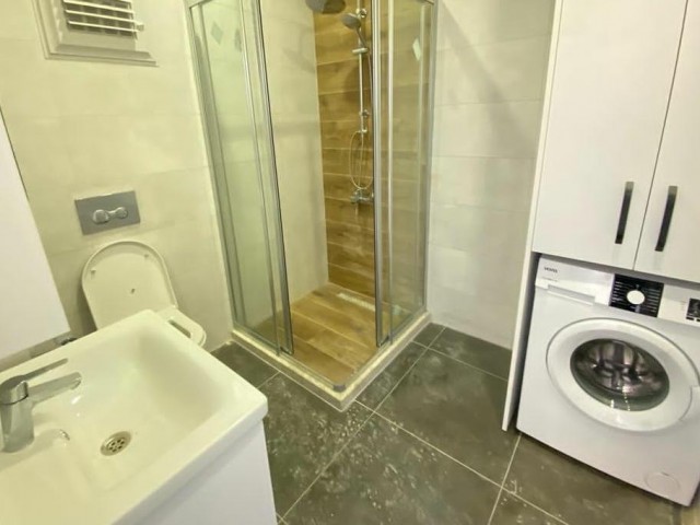 1+1 FLAT FOR SALE IN KYRENIA CENTRAL ASLANLI VILLA AREA WITH SOCIAL FACILITIES SUCH AS SWIMMING POOL AND GYM, FULLY FURNISHED INCLUDING DISHWASHER, SPACIOUS AND SPACIOUS WITH ELEVATOR AND BALCONY