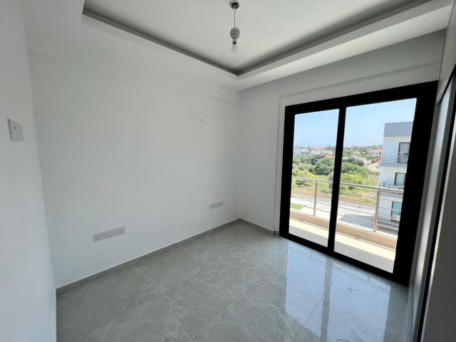 1+1 flat for sale with roof terrace in a site with pool in Alsancak