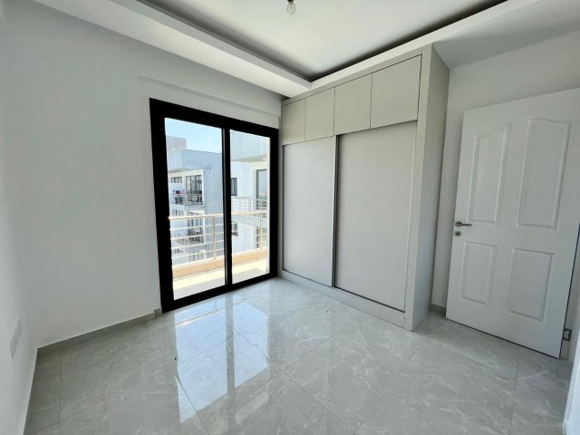 1+1 flat for sale with roof terrace in a site with pool in Alsancak