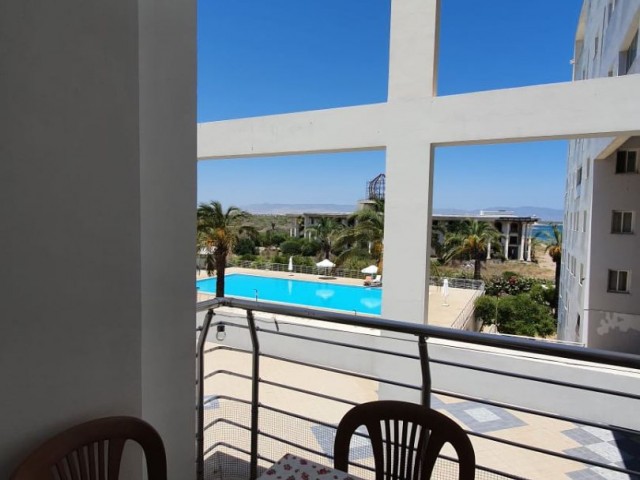 3+1 apartment with shared pool near the sea
