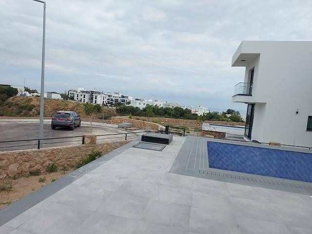 New Modern 3+1 Luxury Villa For Sale In The Peaceful Area Of Çatalköy With Sea View, Private Swimming Pool, and Garden