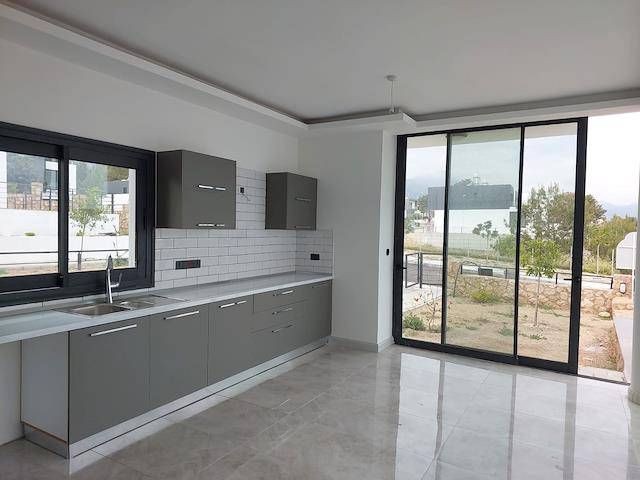 New Modern 3+1 Luxury Villa For Sale In The Peaceful Area Of Çatalköy With Sea View, Private Swimming Pool, and Garden