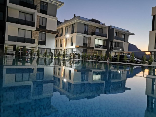 1+1 Apartment with Security and Pool for Sale in Lapta...