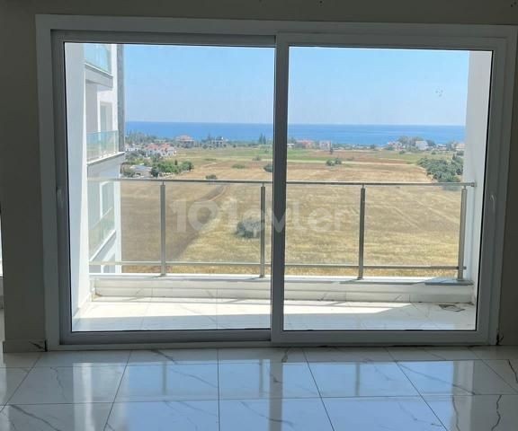 1+1 FLAT FOR SALE in İskele Bahçeler with mountain and sea view and shared pool