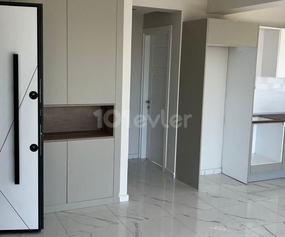 1+1 FLAT FOR SALE in İskele Bahçeler with mountain and sea view and shared pool