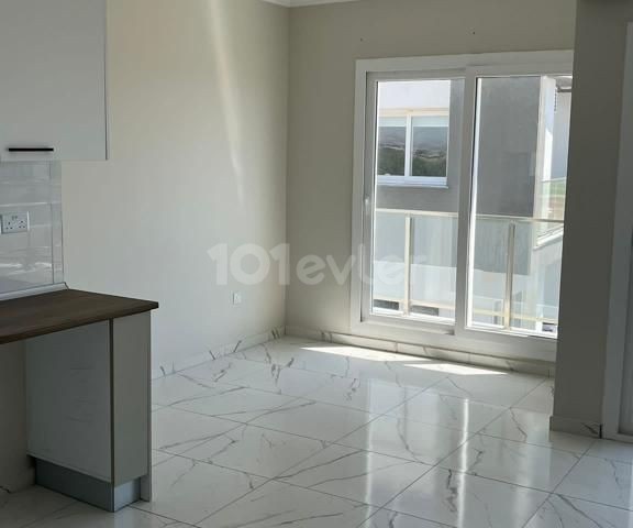 1+1 FLAT FOR SALE in İskele Bahçeler with mountain and sea view and shared pool