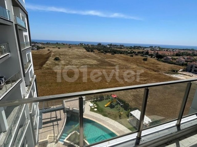 1+1 FLAT FOR SALE in İskele Bahçeler with mountain and sea view and shared pool
