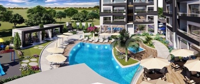 1+1 FLAT FOR SALE in İskele Bahçeler with mountain and sea view and shared pool