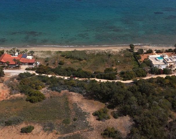 Located at the Seafront, with Commercial and Residential Permits, with a Road, 2 Acres of 1 Evlek Land with Perfect Location for sale, whether for villa or investment!
