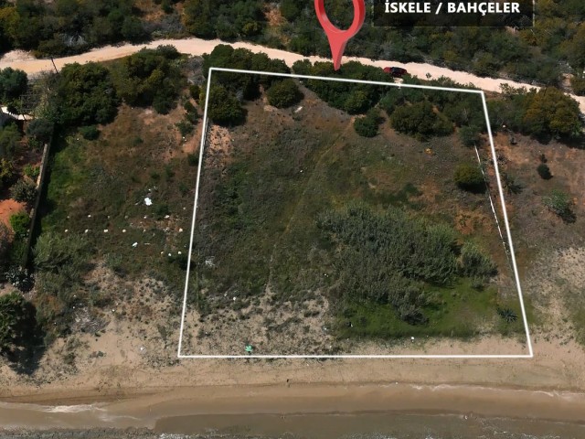 Located at the Seafront, with Commercial and Residential Permits, with a Road, 2 Acres of 1 Evlek Land with Perfect Location for sale, whether for villa or investment!