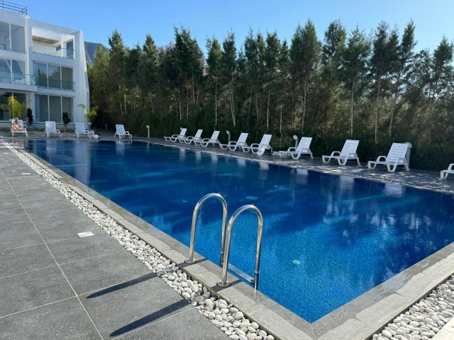 LUXURY FLAT WITH CLOSED PARKING CAMERA SYSTEM AND COMMON POOL IN GIRNE DOĞANKÖY.