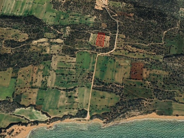 4 acres of 3 Evlek land adjacent to the sea at a bargain price!