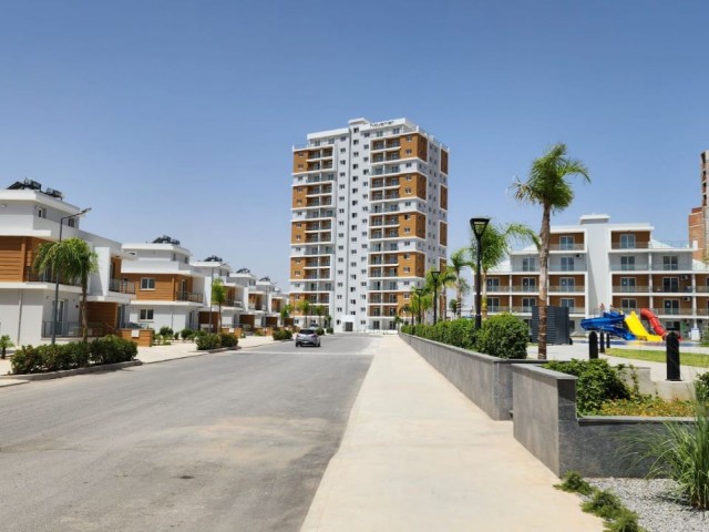 kelepır fıyat İskele Long Beach'de, Royal Sun Elite sitesinde, satılık 2+1  daire ( teslime hazir  ,  kdv, trafo  ,ödenmiş) en az aylık 600 stg kira geliri garanti